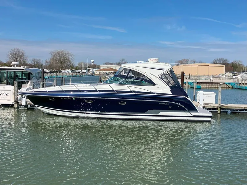 Slide: The Image of 2016 Formula 37 PC yacht docked in a marina under clear blue skies. - 6