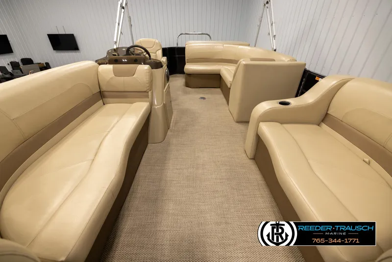 Slide: The Image of Interior of a 2017 Crest 200 L CPT pontoon boat with beige seating. - 13