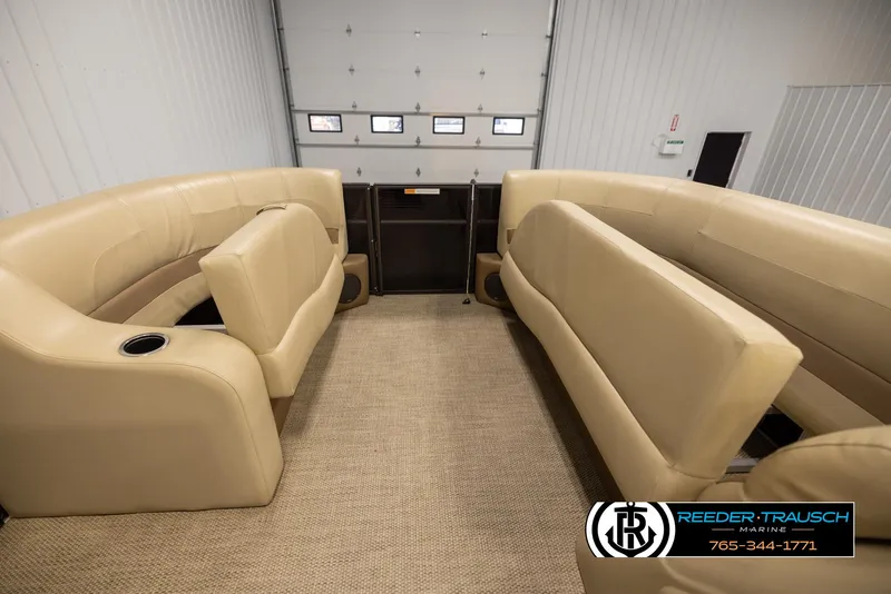 Slide: The Image of 2017 Crest 200 L CPT pontoon boat interior with beige seating and carpet flooring. - 19