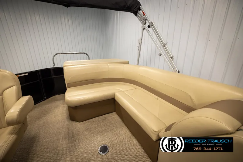 Slide: The Image of 2017 Crest 200 L CPT pontoon boat interior with beige seating and carpet flooring. - 20
