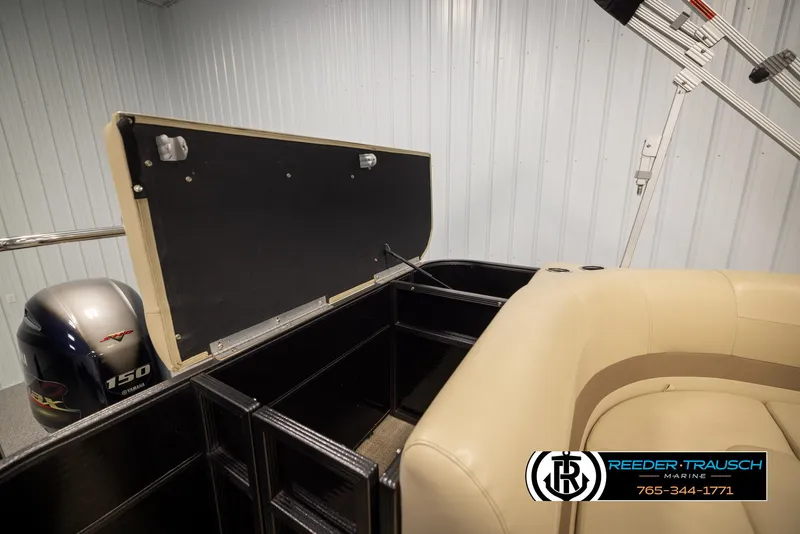 Slide: The Image of 2017 Crest 200 L CPT pontoon boat interior with storage and 150 HP engine. - 24