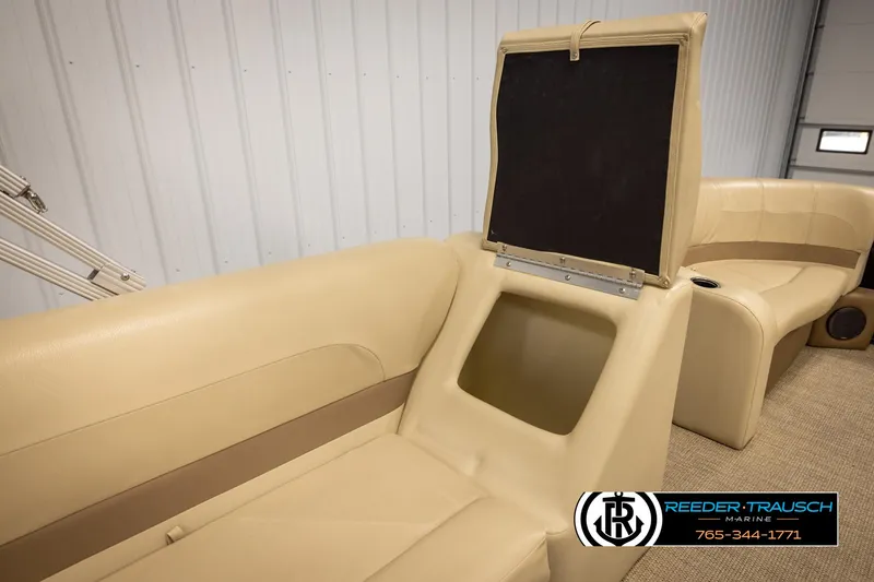 Slide: The Image of 2017 Crest 200 L CPT boat interior with beige seating and storage compartment. - 26