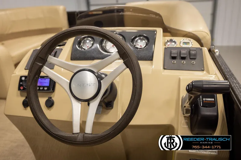 Slide: The Image of Steering console of a 2017 Crest 200 L CPT boat with controls and gauges. - 27