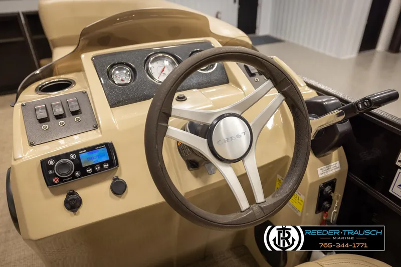 Slide: The Image of Steering console of 2017 Crest 200 L CPT boat with gauges and controls. - 28