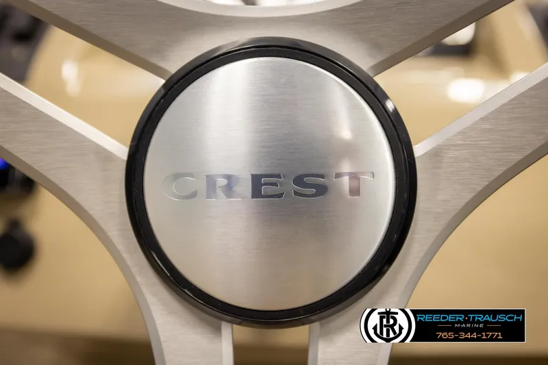Slide: The Image of Steering wheel of 2017 Crest 200 L CPT boat with logo. - 29
