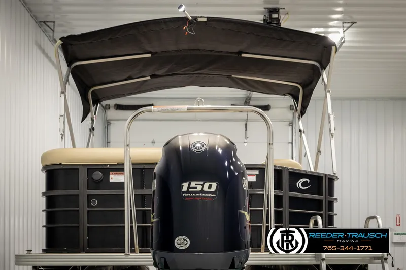 Slide: The Image of 2017 Crest 200 L CPT pontoon boat with 150 horsepower engine in indoor storage. - 7