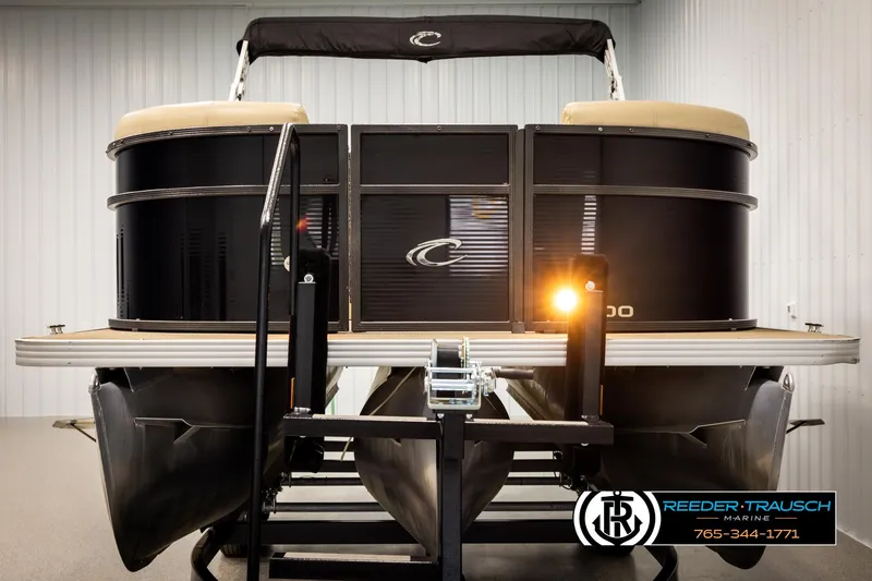 Slide: The Image of 2017 Crest 200 L CPT pontoon boat on trailer in indoor storage. - 8