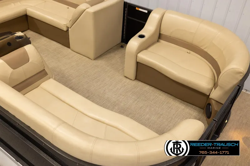 Slide: The Image of 2017 Crest 200 L CPT pontoon boat interior with beige seating and carpet flooring. - 9