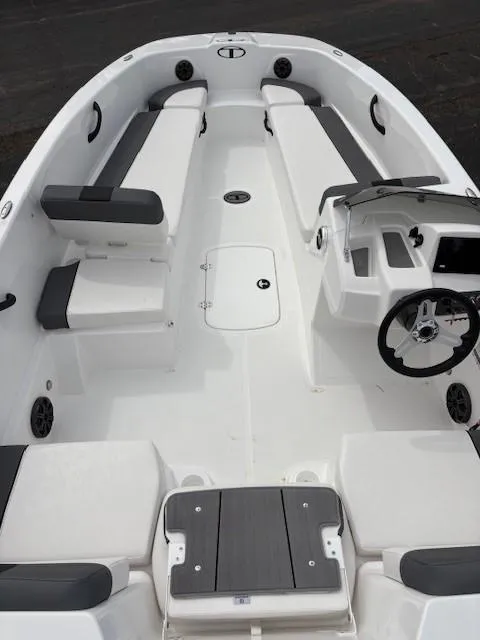 Slide: The Image of 2025 Tahoe T18 boat interior with sleek seating and modern steering console. - 3