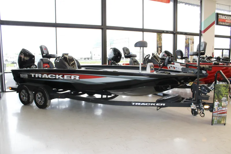 The Image of 2025 Tracker Savage 215 boat displayed indoors on a trailer. - 0