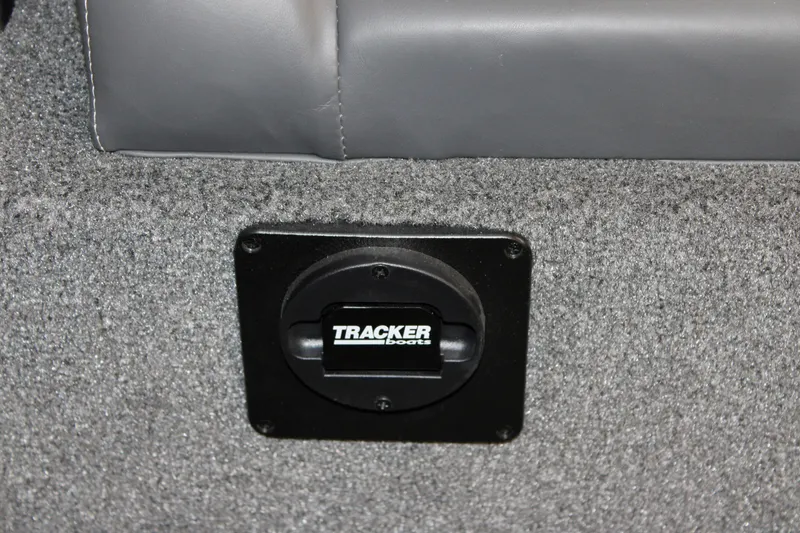 Slide: The Image of Tracker Savage 215 boat interior detail with branded latch, 2025 model. - 99