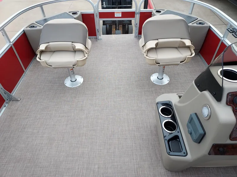 Slide: The Image of 2025 Sun Tracker Party Barge 18 DLX interior with beige seats and red accents. - 3