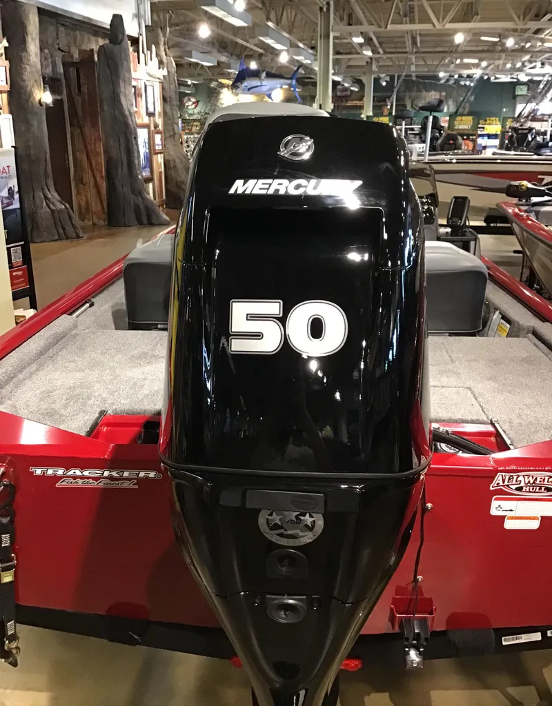 Slide: The Image of 2025 Tracker Pro 170 boat with Mercury 50 outboard motor in showroom. - 2