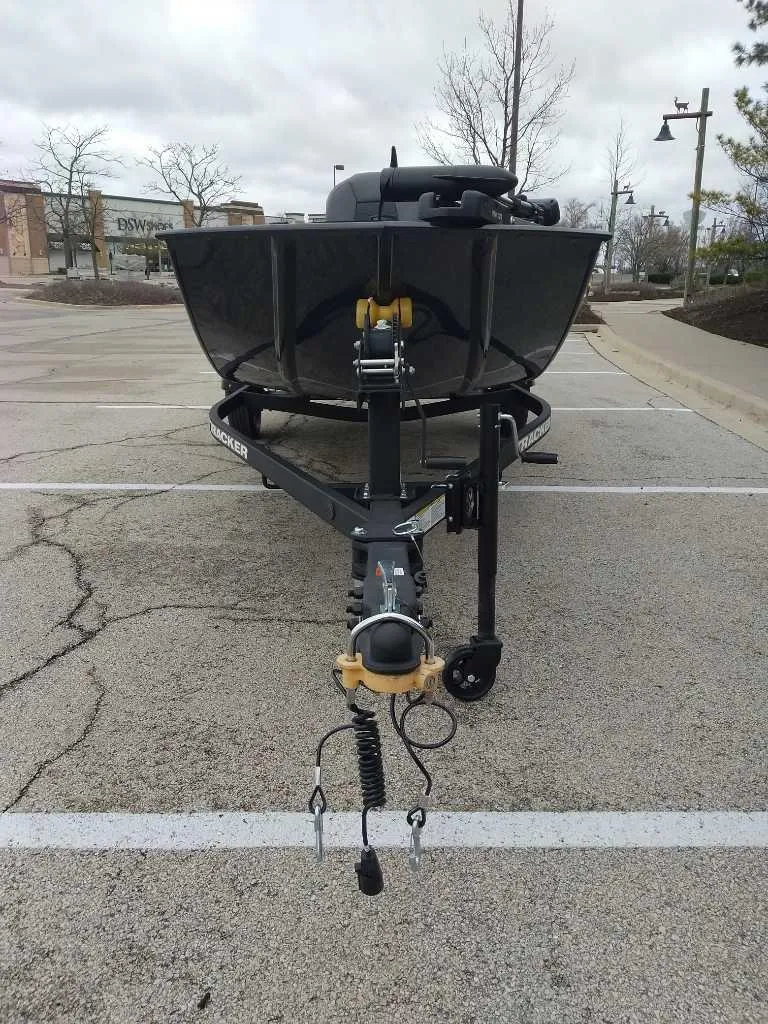 Slide: The Image of 2025 Tracker Panfish 17 boat on trailer in parking lot. - 5