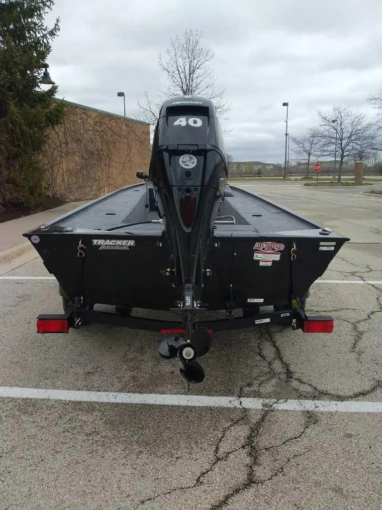 Slide: The Image of 2025 Tracker Panfish 17 boat with 40 HP motor in parking lot. - 6