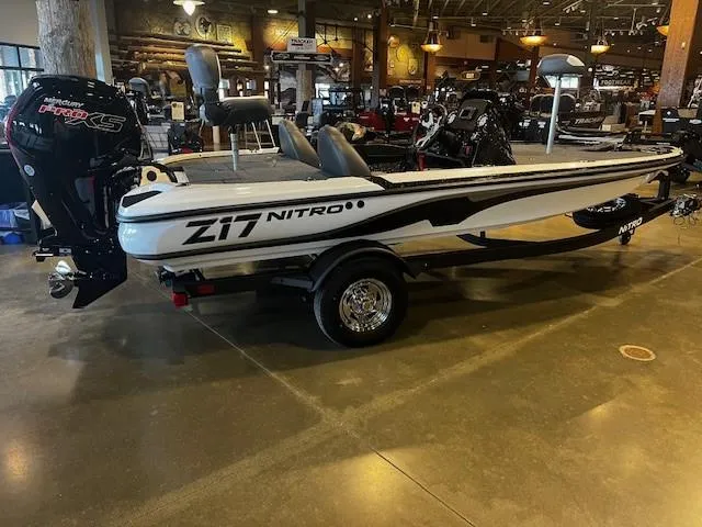 Slide: The Image of 2025 Nitro Z17 boat in showroom, featuring sleek design and powerful engine. - 0