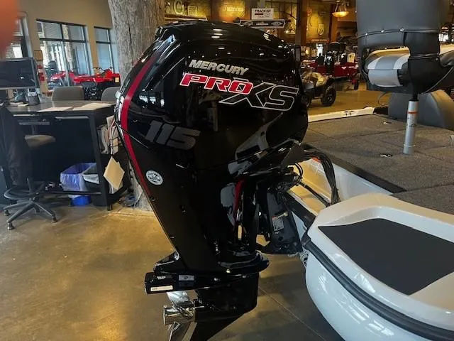 Slide: The Image of Mercury Pro XS 115 outboard motor on a 2025 Nitro Z17 boat in showroom. - 3