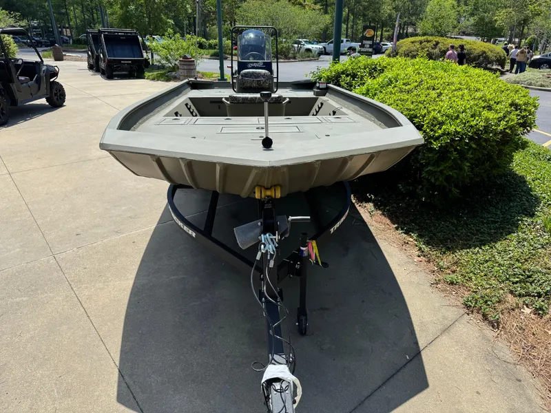 Slide: The Image of 2025 Tracker Grizzly 2072 CC boat on trailer, parked outdoors. - 5