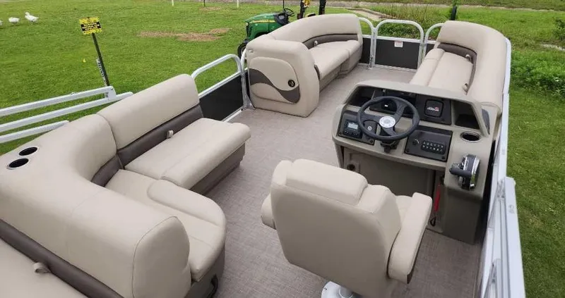 Slide: The Image of 2025 Sun Tracker Party Barge 18 DLX pontoon boat with spacious seating and modern helm. - 5