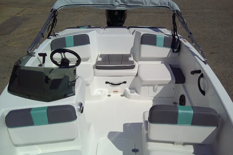 Slide: The Image of 2025 Tahoe T16 boat interior with seating and steering wheel, featuring modern design elements. - 7