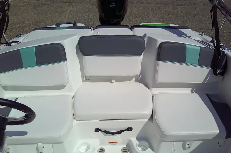 Slide: The Image of 2025 Tahoe T16 boat interior with white and gray seating, teal accents. - 8