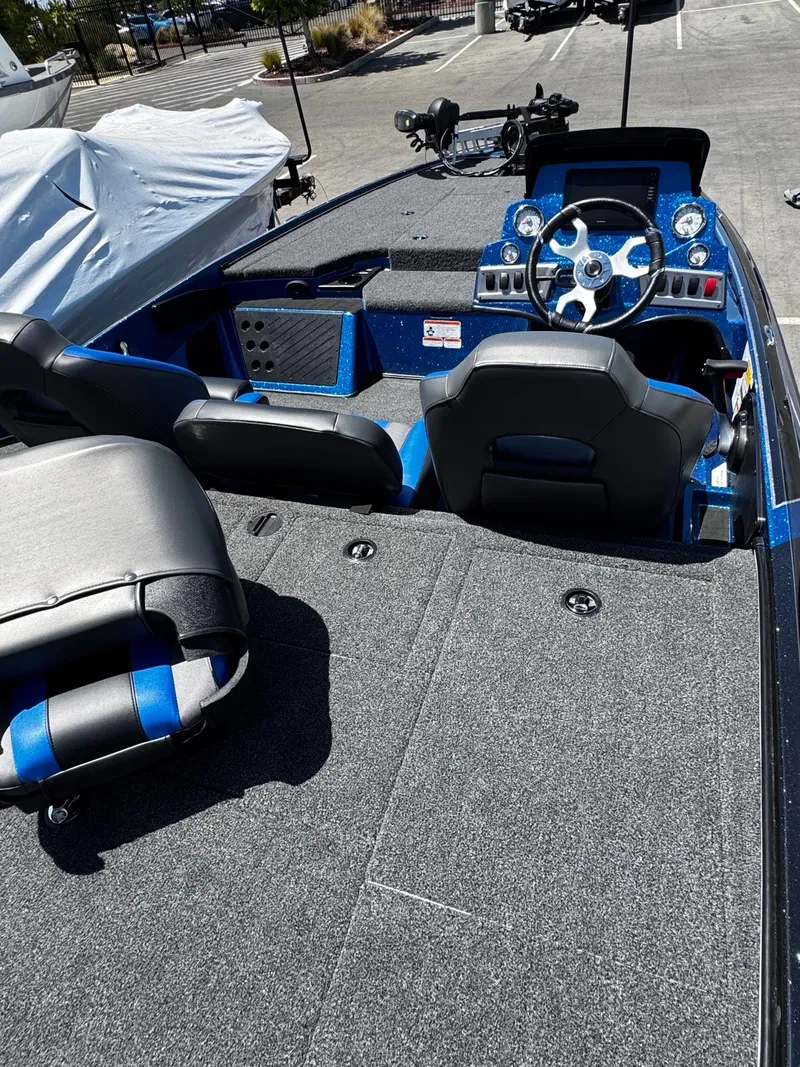 Slide: The Image of Interior of a 2025 Nitro Z19 Pro boat, featuring seating and steering console. - 4