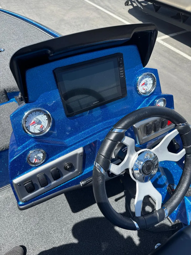 Slide: The Image of Dashboard of a 2025 Nitro Z19 Pro boat with steering wheel and gauges. - 6