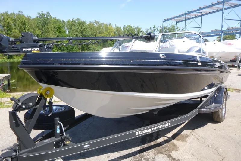 Slide: The Image of 2024 Ranger 1850MS boat on trailer, featuring Minn Kota Terrova motor, parked near water. - 4