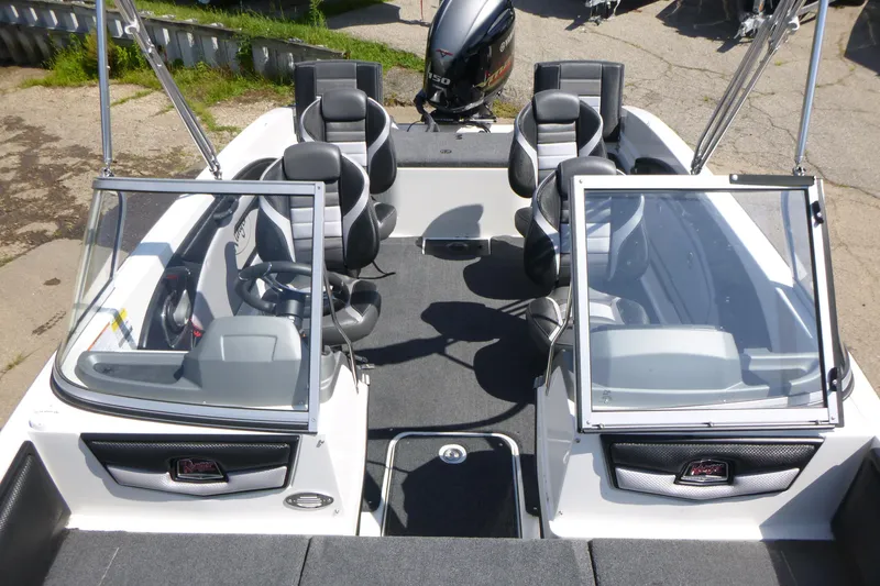 Slide: The Image of 2024 Ranger 1850MS boat interior with seating and steering wheel, featuring a Yamaha outboard motor. - 7