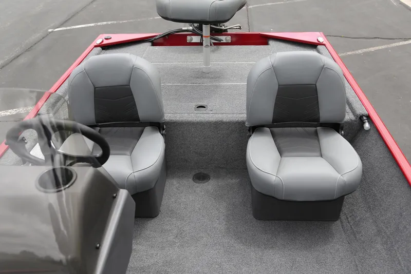 Slide: The Image of 2025 Tracker Bass Tracker Classic XL boat interior with gray seating and red accents. - 4