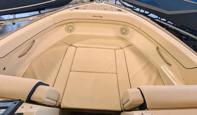 Slide: The Image of 2023 Chris-Craft Calypso 24 boat interior with beige seating and elegant design. - 15