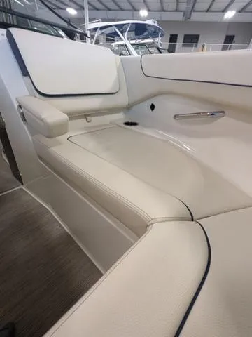 Slide: The Image of 2023 Chris-Craft Calypso 24 boat interior with beige seating and sleek design. - 16
