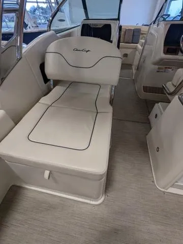 Slide: The Image of 2023 Chris-Craft Calypso 24 interior with white seating and modern design. - 24