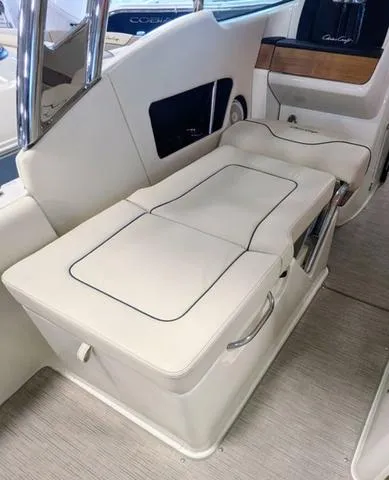 Slide: The Image of 2023 Chris-Craft Calypso 24 boat interior with cream seating and sleek design. - 26