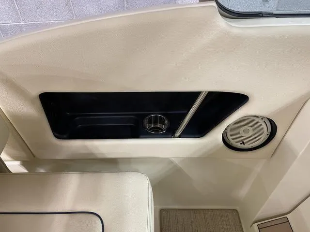 Slide: The Image of 2023 Chris-Craft Calypso 24 interior detail with cup holder and speaker. - 29