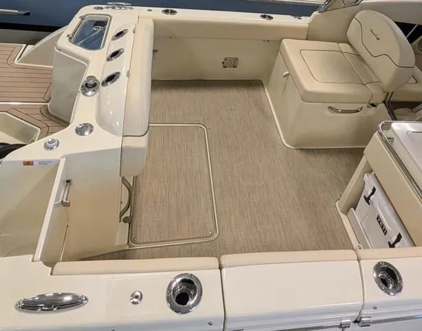 Slide: The Image of 2023 Chris-Craft Calypso 24 boat interior with beige seating and modern amenities. - 4
