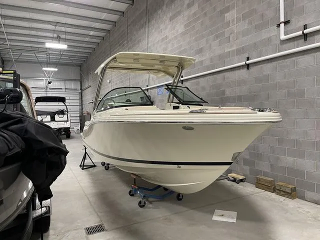 Slide: The Image of 2023 Chris-Craft Calypso 24 boat in a storage facility. - 45