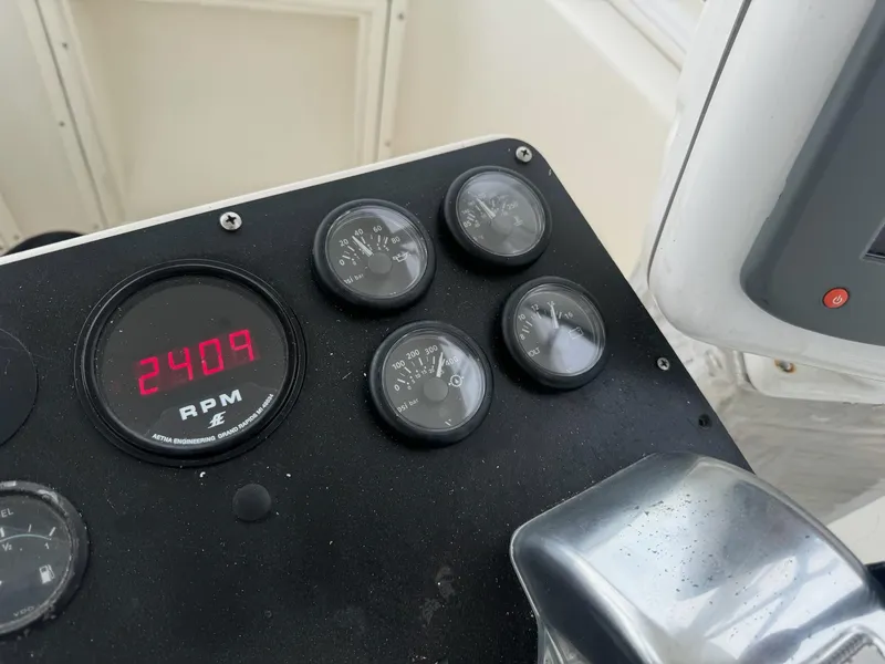 Slide: The Image of Control panel of 1985 Blackfin 32 Flybridge showing RPM and gauges. - 15