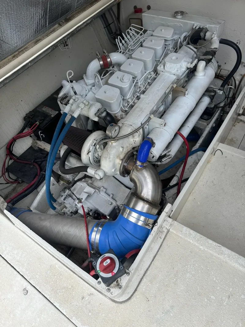 Slide: The Image of 1985 Blackfin 32 Flybridge engine compartment showcasing a well-maintained marine engine. - 7