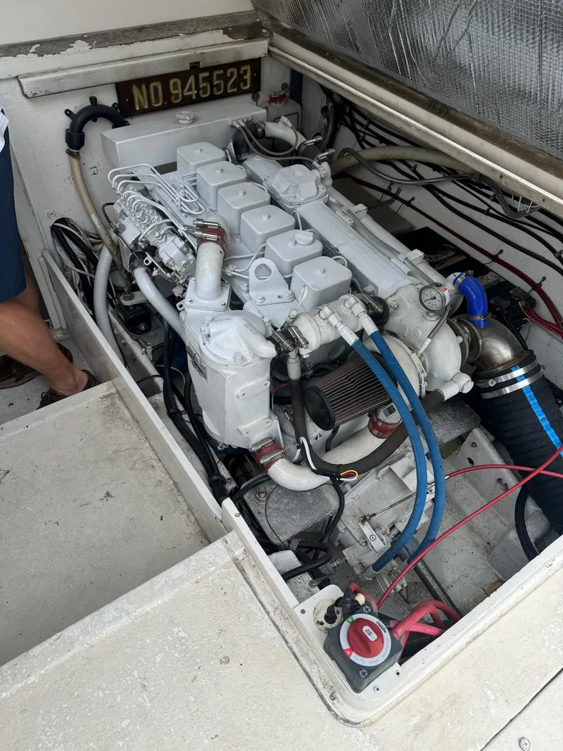 Slide: The Image of 1985 Blackfin 32 Flybridge engine compartment with visible wiring and components. - 8