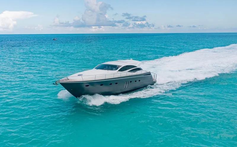 Slide: The Image of 2007 Pershing 62' yacht cruising on turquoise ocean waters. - 0
