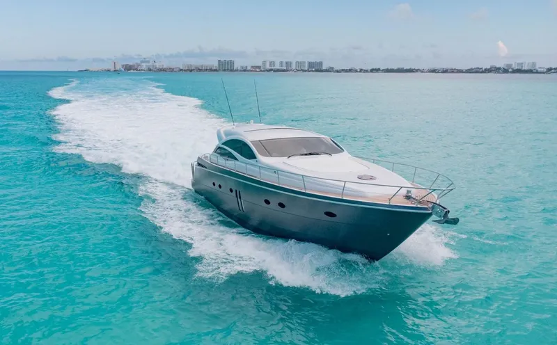 Slide: The Image of 2007 Pershing 62' yacht cruising on turquoise ocean waters. - 1