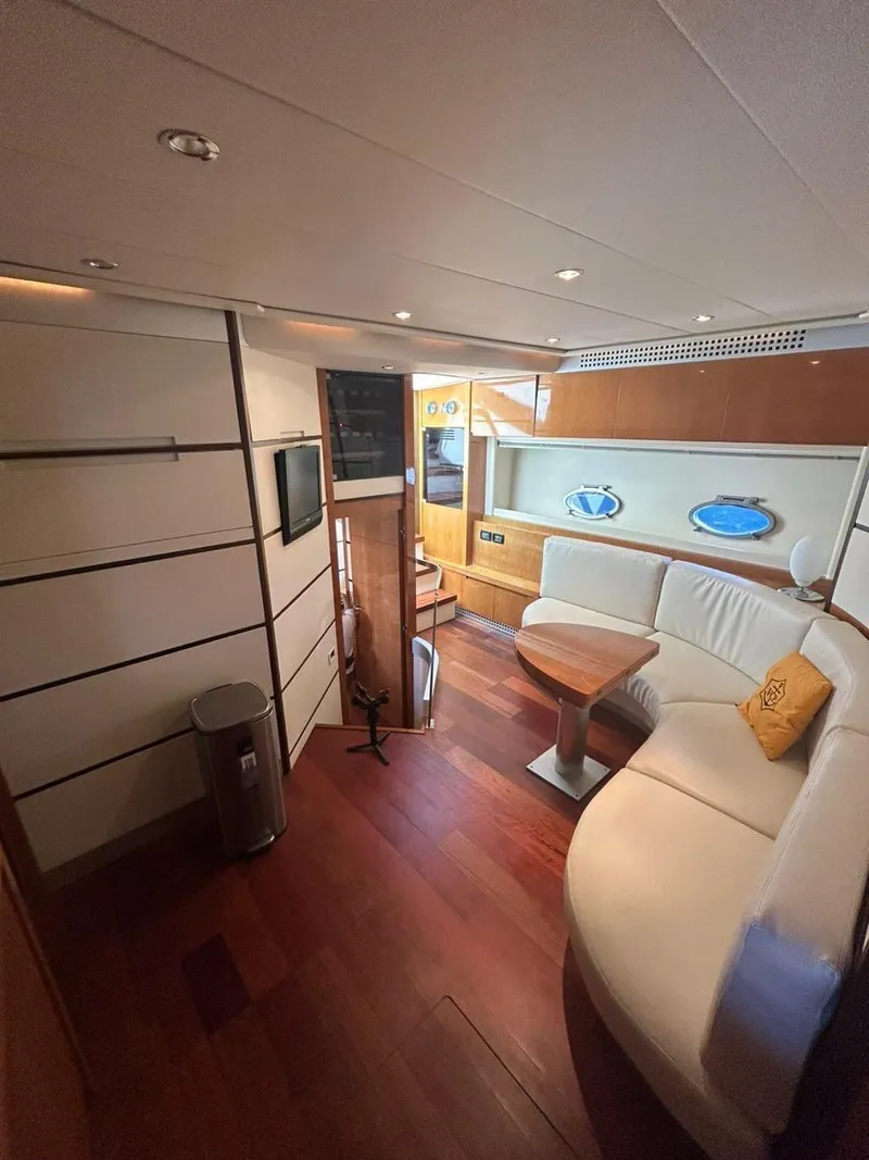 Slide: The Image of Luxurious interior of a 2007 Pershing 62' yacht with elegant wood flooring and modern furnishings. - 10