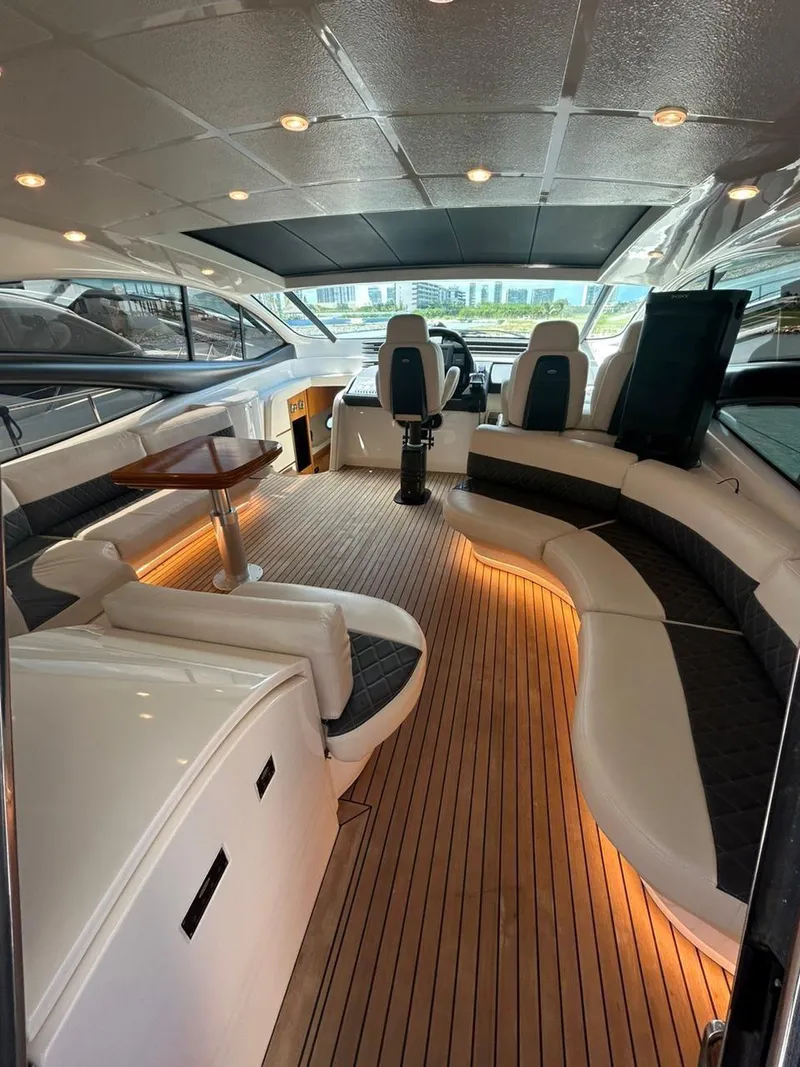 Slide: The Image of Luxurious 2007 Pershing 62' yacht interior with elegant seating and ambient lighting. - 14