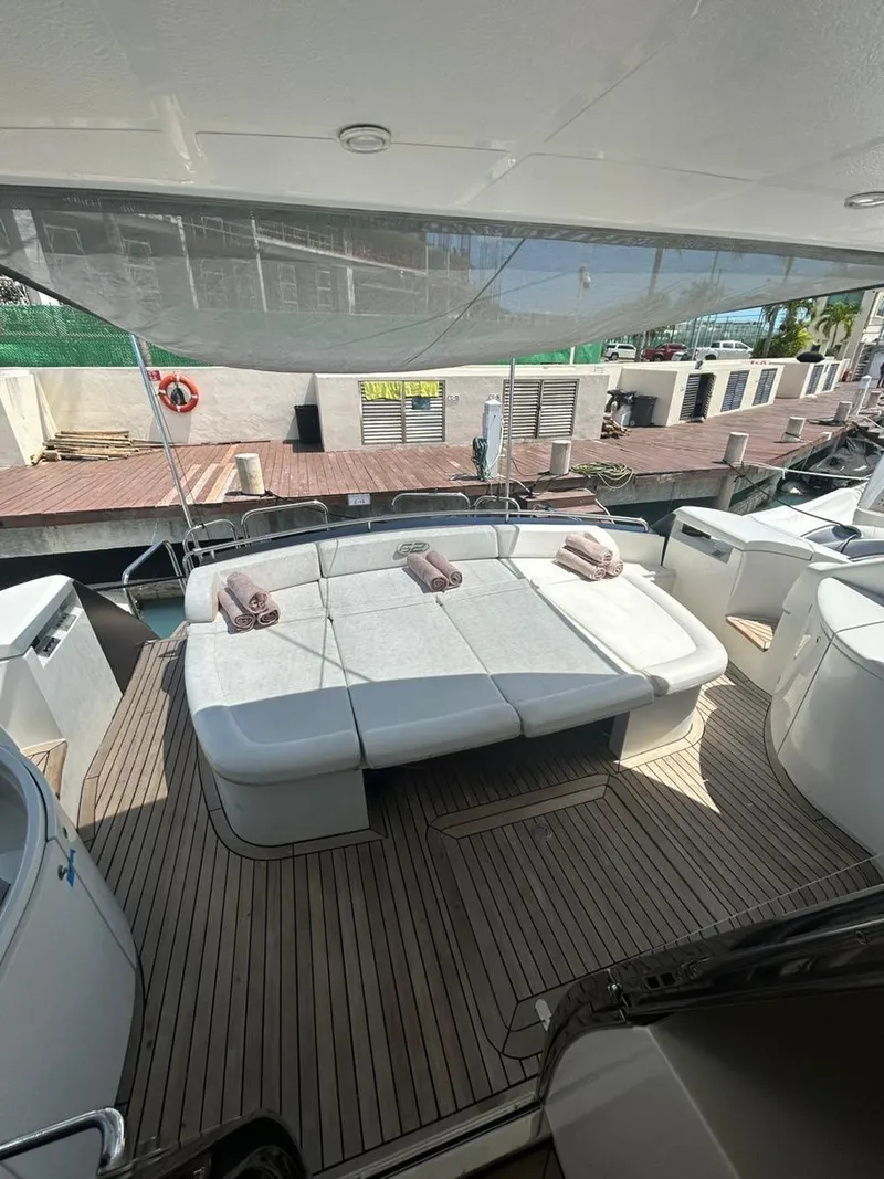 Slide: The Image of Luxurious 2007 Pershing 62' yacht with spacious deck seating and elegant design. - 16