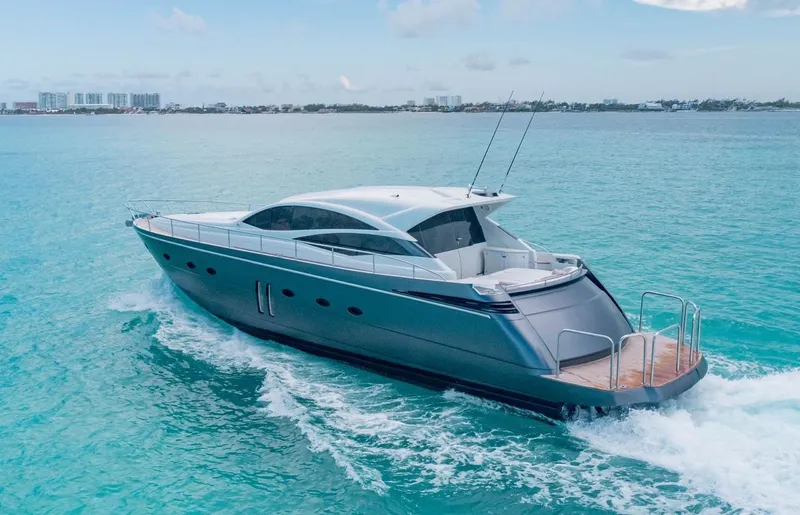 Slide: The Image of 2007 Pershing 62' yacht cruising on clear blue waters. - 2