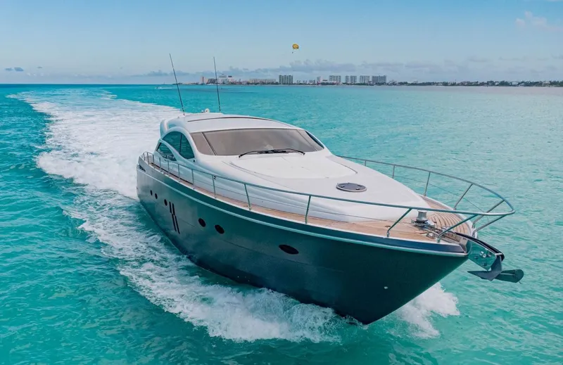 Slide: The Image of 2007 Pershing 62' yacht cruising on turquoise ocean waters. - 4