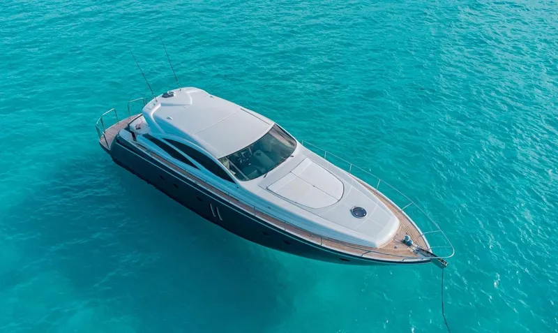 Slide: The Image of 2007 Pershing 62' yacht on clear turquoise water, aerial view. - 6
