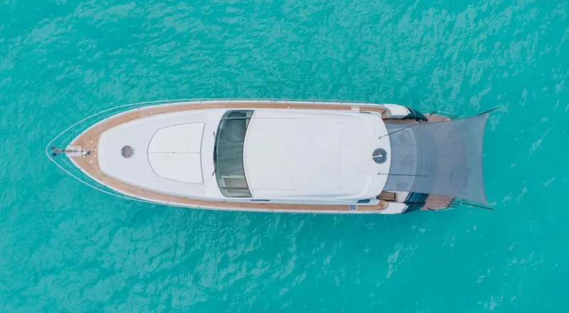 Slide: The Image of Aerial view of 2007 Pershing 62' yacht on turquoise water. - 8