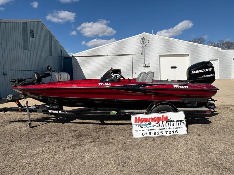 Slide: The Image of 2007 Triton Tr-186 SC boat on trailer, displayed at Hennepin Marine dealership. - 0